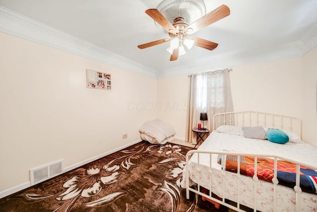 bedroom featuring baseboards, visible vents, ceiling fan, and ornamental molding