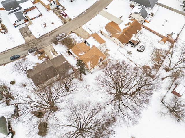 snowy aerial view featuring a residential view