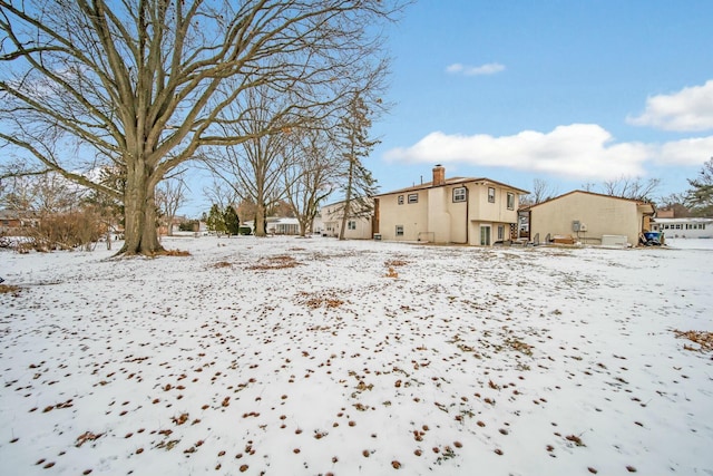 view of yard covered in snow