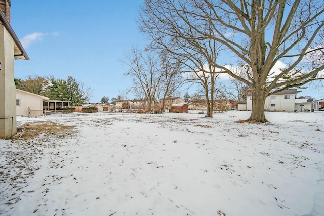 view of yard covered in snow