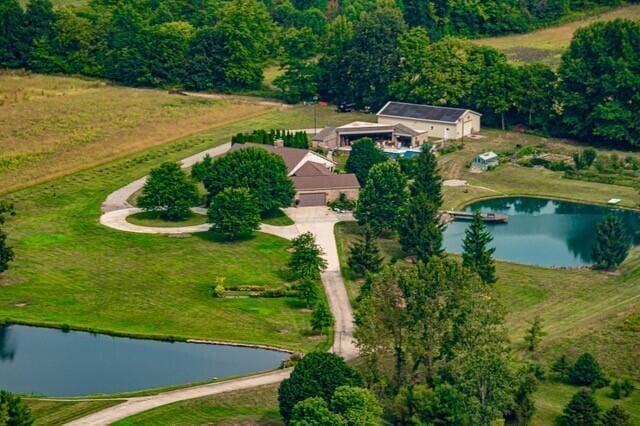 birds eye view of property featuring a water view