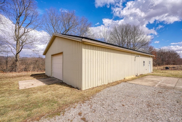 detached garage featuring driveway