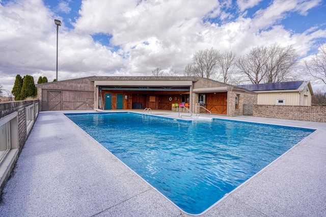 view of pool with a fenced in pool, a patio, and fence