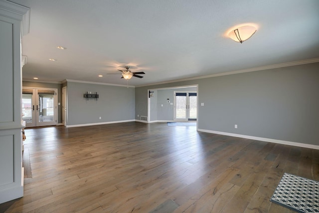 unfurnished living room featuring wood-type flooring, a ceiling fan, and french doors