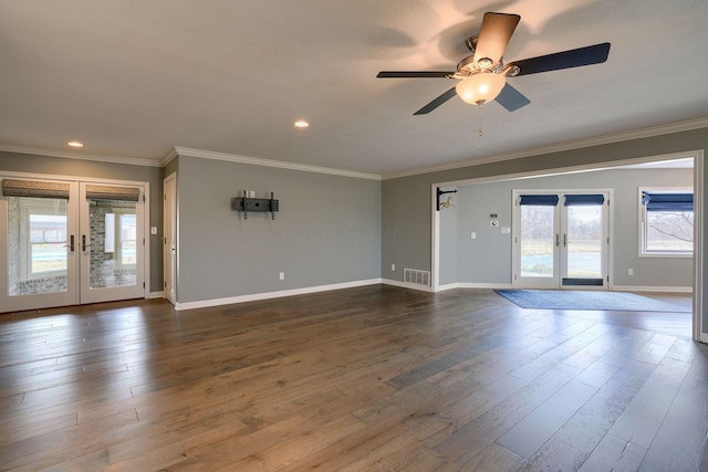 interior space with crown molding, visible vents, dark wood-style flooring, and french doors