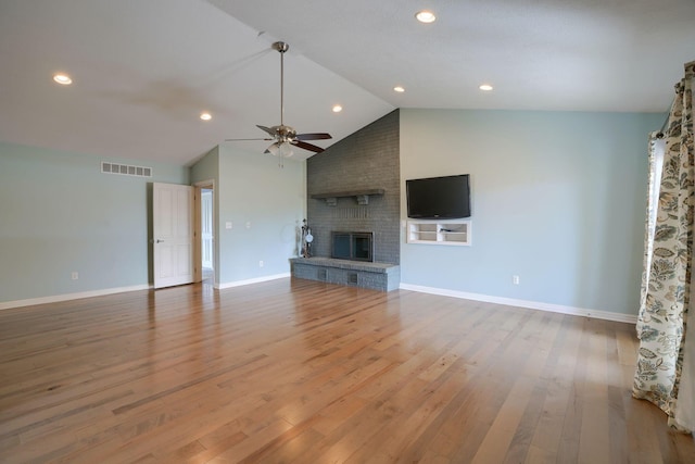 unfurnished living room with a fireplace, visible vents, ceiling fan, wood finished floors, and baseboards