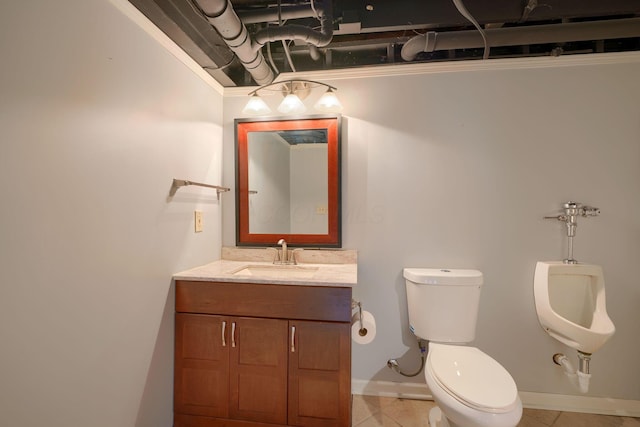 half bath with tile patterned flooring, baseboards, vanity, and toilet