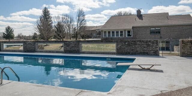 view of pool featuring a fenced in pool and fence