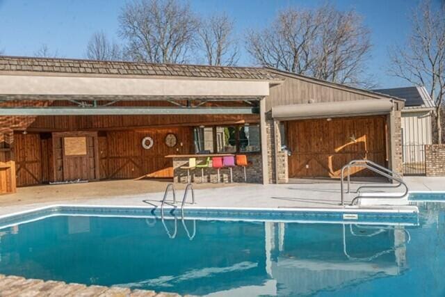 outdoor pool featuring a patio area