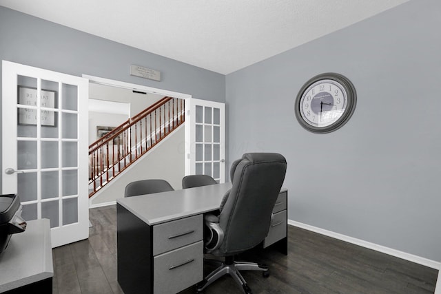 office space featuring dark wood-style floors, baseboards, a textured ceiling, and french doors