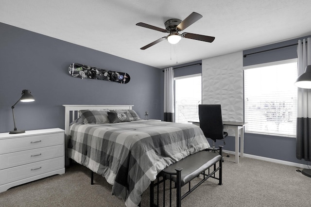 bedroom with carpet flooring, a ceiling fan, and baseboards