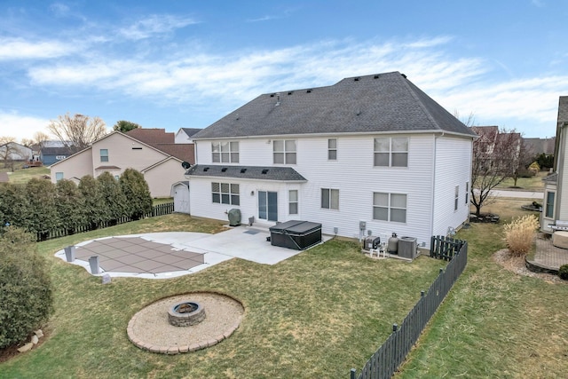 back of property featuring a patio area, a fenced backyard, central AC unit, and a yard