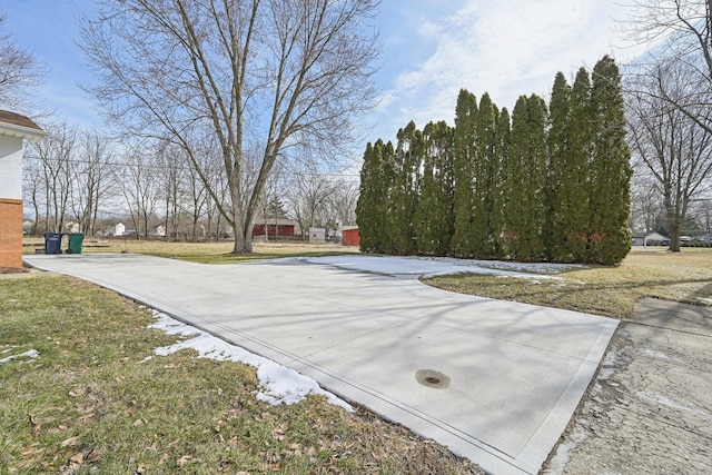 exterior space with concrete driveway