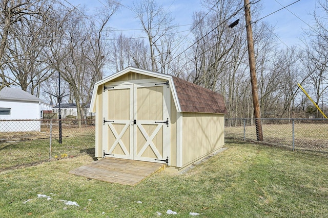 view of shed with a fenced backyard