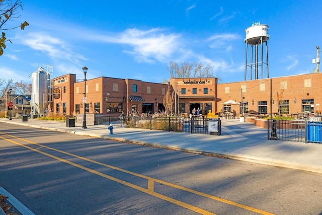 view of building exterior featuring fence