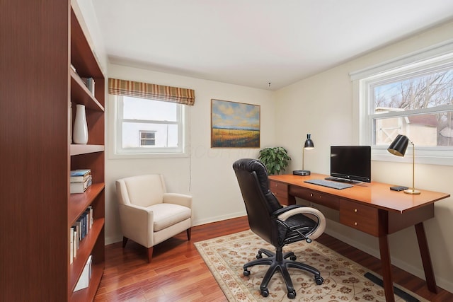 office area featuring wood finished floors and baseboards