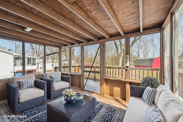 sunroom featuring wooden ceiling and beam ceiling