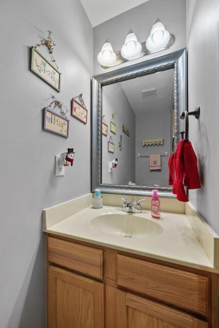 bathroom with visible vents and vanity