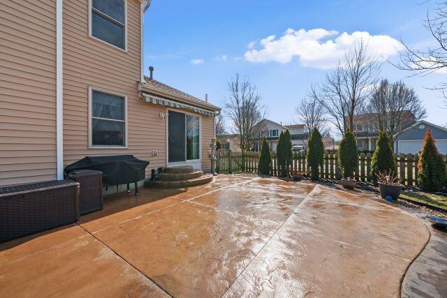 view of patio / terrace featuring entry steps and fence