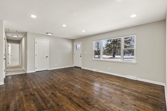 interior space featuring visible vents, recessed lighting, baseboards, and wood finished floors