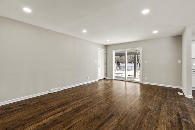 unfurnished room featuring recessed lighting, baseboards, and dark wood-style flooring