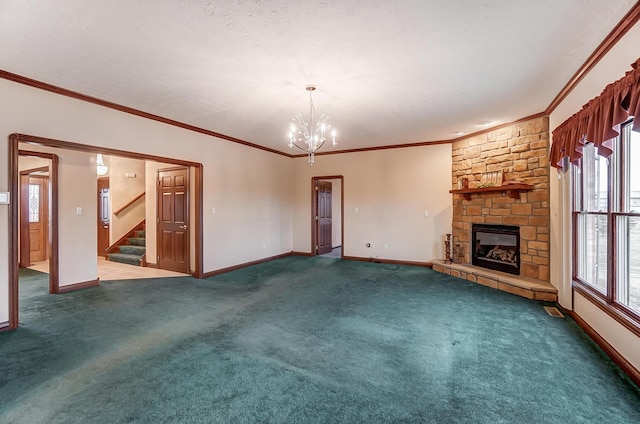 unfurnished living room with dark colored carpet, a stone fireplace, baseboards, and stairs