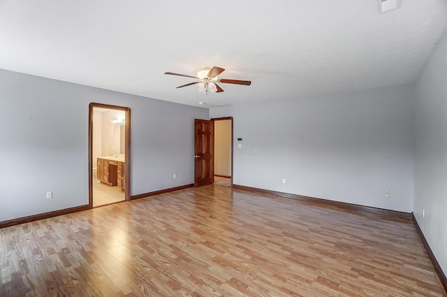 unfurnished room featuring light wood-style floors, ceiling fan, and baseboards