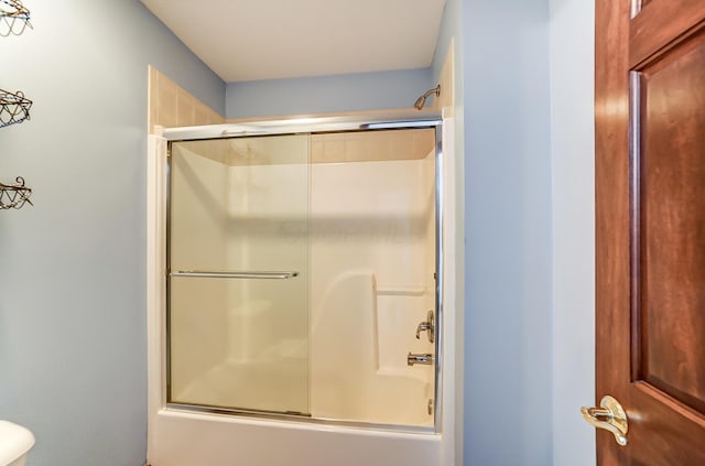 full bathroom featuring combined bath / shower with glass door