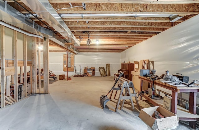 unfinished basement featuring electric panel