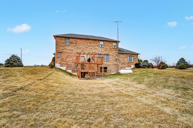 rear view of property with a lawn