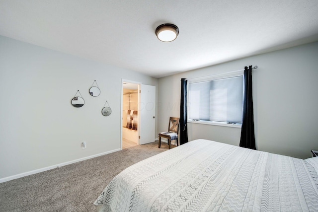 bedroom featuring light carpet and baseboards