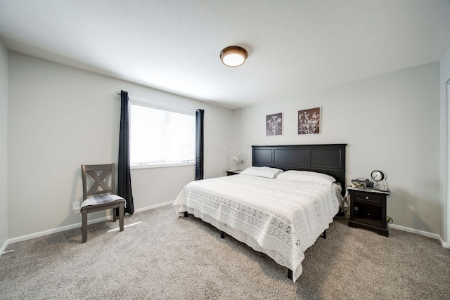 bedroom featuring carpet floors and baseboards