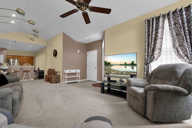 living area with a wealth of natural light, lofted ceiling, light carpet, and recessed lighting