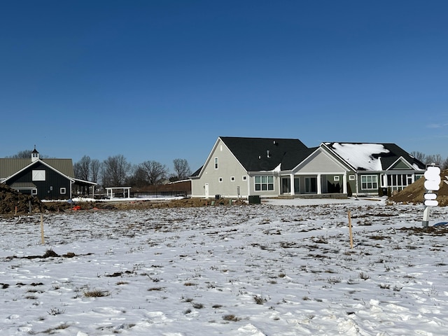 view of snow covered house