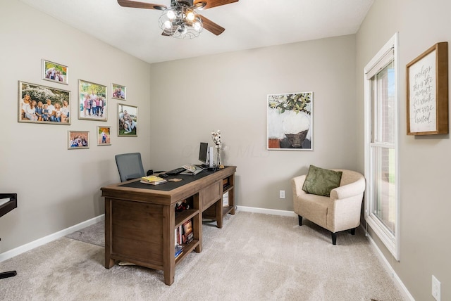 office featuring carpet, baseboards, and a ceiling fan