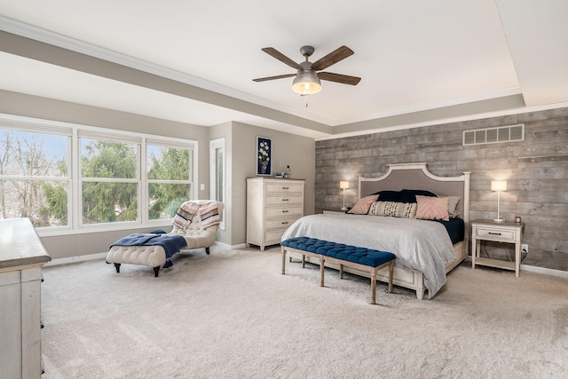 bedroom featuring light colored carpet, visible vents, and crown molding