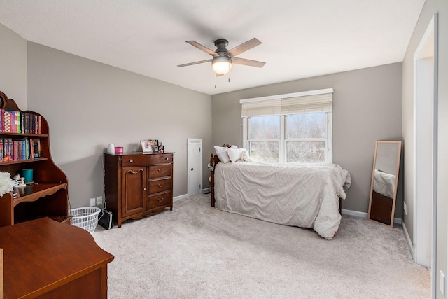 bedroom featuring light carpet, ceiling fan, and baseboards