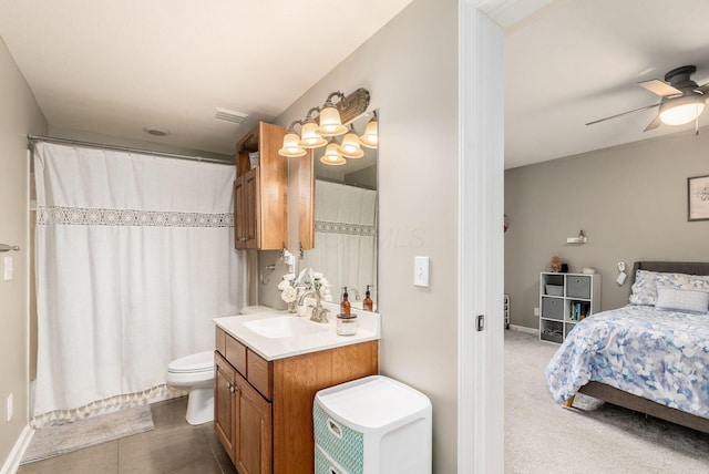 bathroom with visible vents, a ceiling fan, a shower with shower curtain, toilet, and vanity