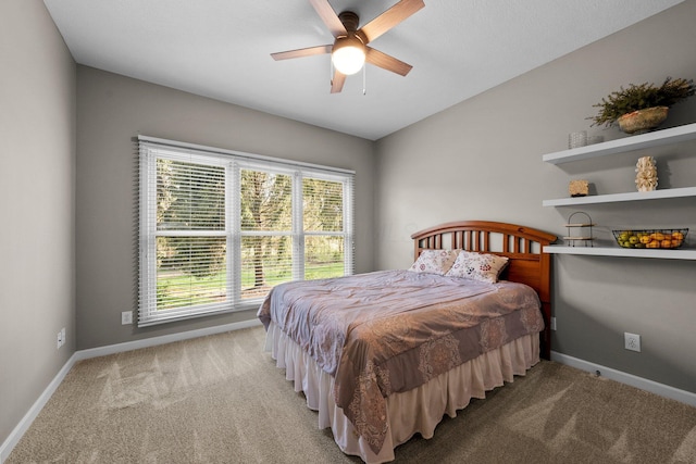 bedroom featuring carpet flooring, a ceiling fan, and baseboards