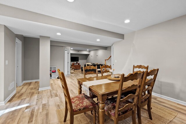 dining space with light wood-style floors, stairs, recessed lighting, baseboards, and visible vents