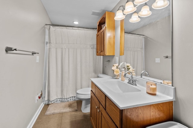 bathroom featuring visible vents, baseboards, tile patterned floors, vanity, and toilet