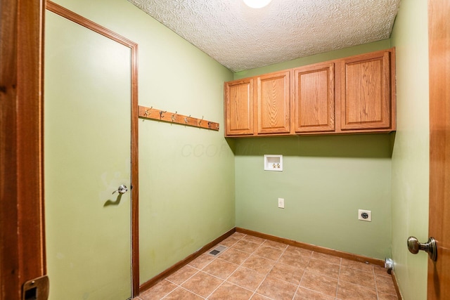 clothes washing area with washer hookup, cabinet space, visible vents, hookup for an electric dryer, and baseboards