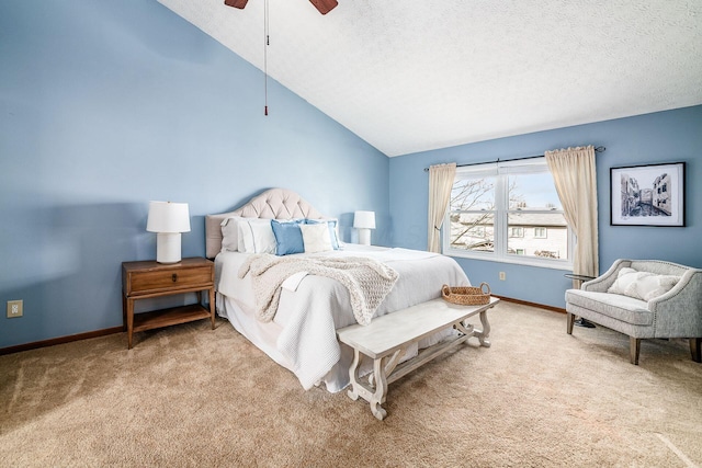 carpeted bedroom with lofted ceiling, ceiling fan, baseboards, and a textured ceiling