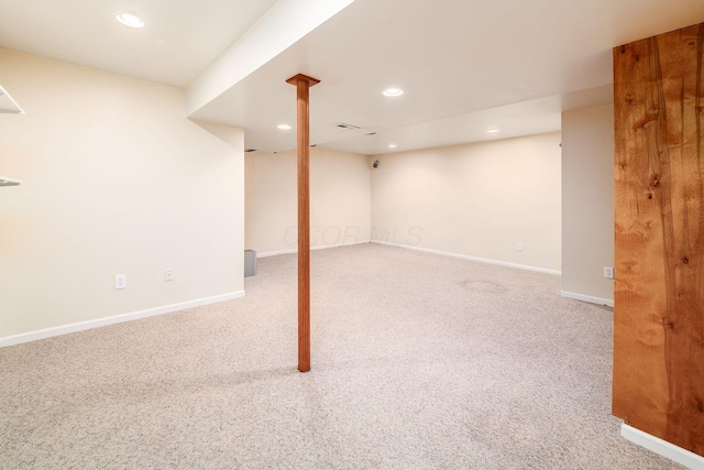 finished basement featuring recessed lighting, carpet flooring, and baseboards