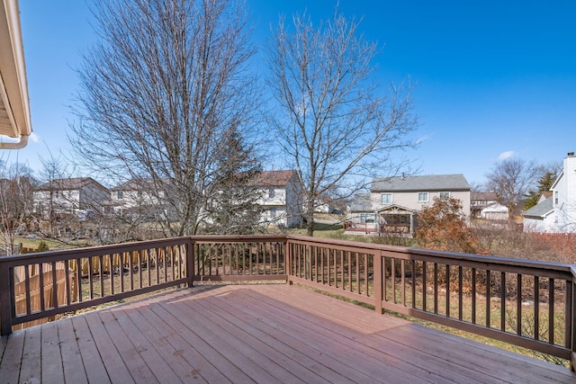 wooden terrace featuring a residential view