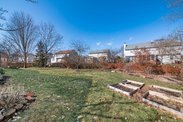 view of yard featuring a garden and fence