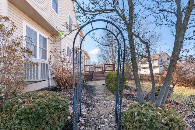 view of yard with a deck and central AC