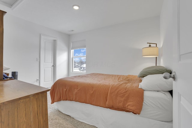 carpeted bedroom featuring recessed lighting