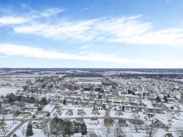 snowy aerial view with a residential view