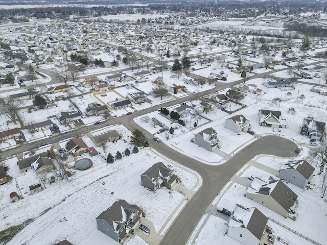 snowy aerial view featuring a residential view